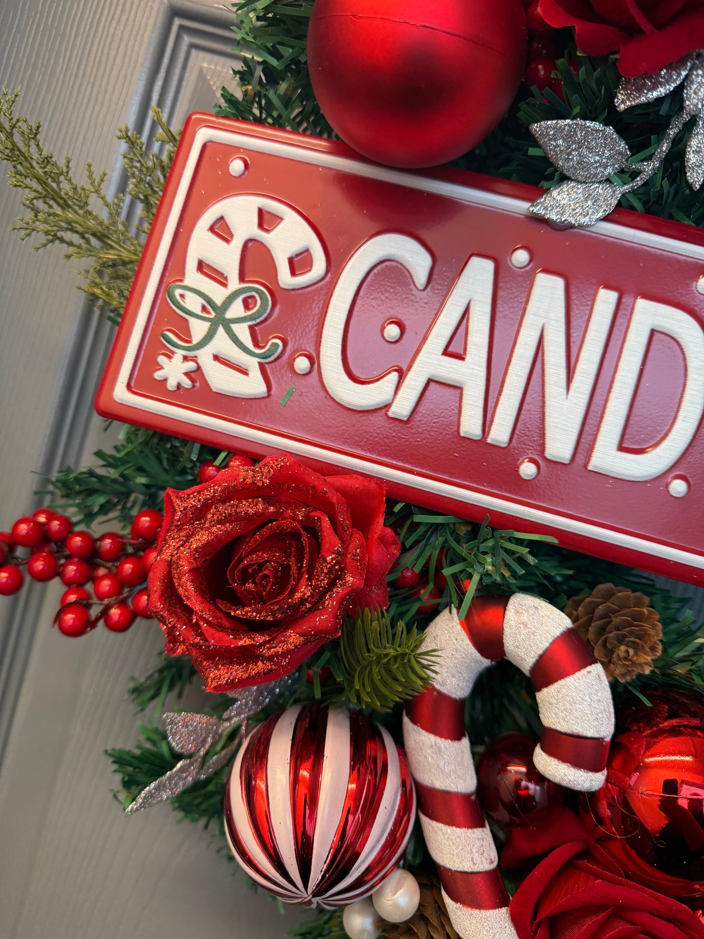 Candy Cane Lane Christmas Artificial Wreath – Gingerbread & Candy Theme Door Decor – Red & White Holiday Wreath with Baubles, Berries, Roses & Sign