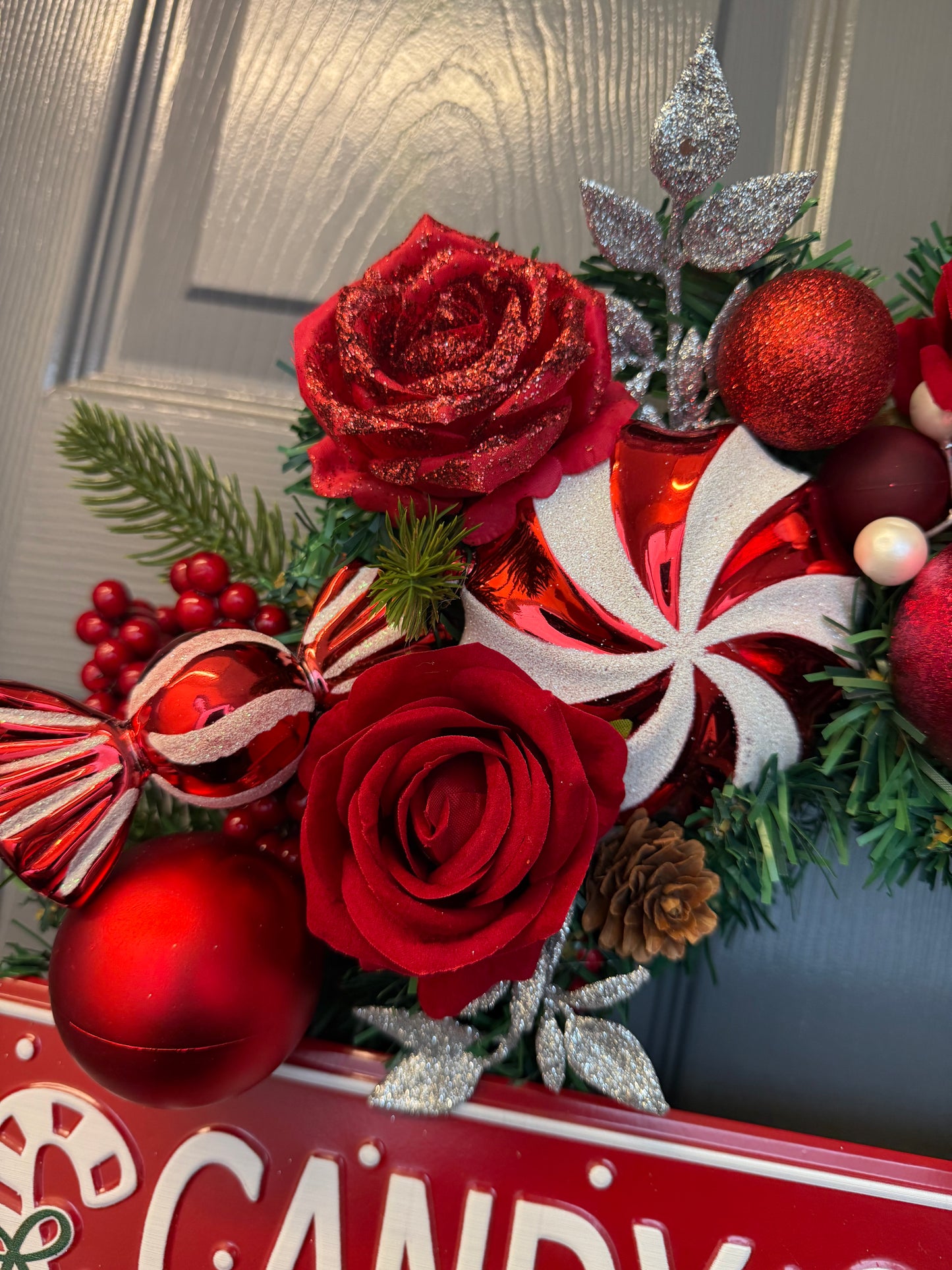 Candy Cane Lane Christmas Artificial Wreath – Gingerbread & Candy Theme Door Decor – Red & White Holiday Wreath with Baubles, Berries, Roses & Sign