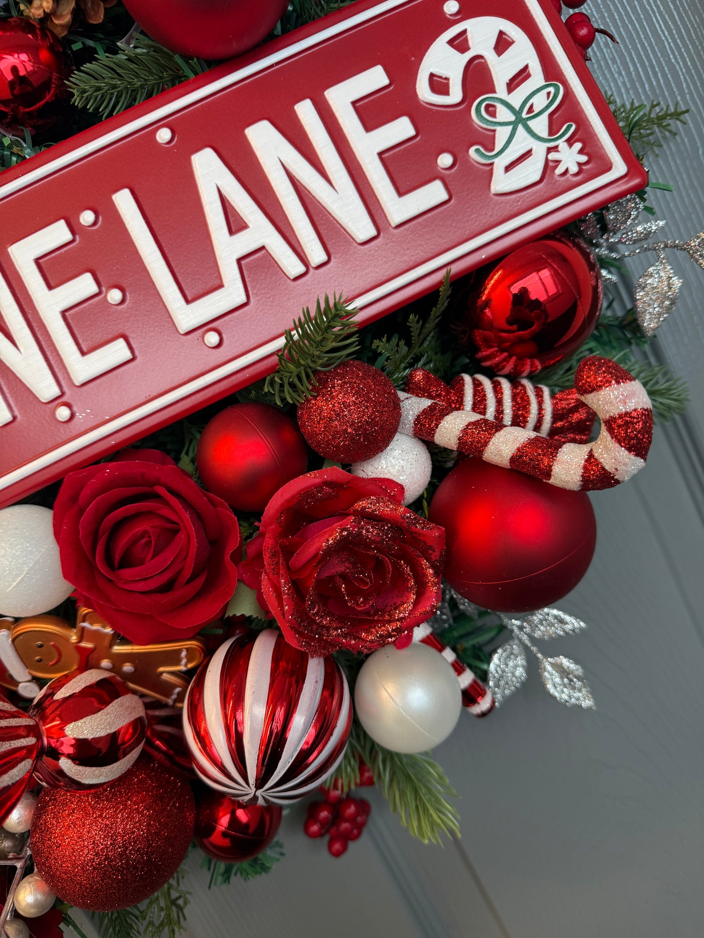 Candy Cane Lane Christmas Artificial Wreath – Gingerbread & Candy Theme Door Decor – Red & White Holiday Wreath with Baubles, Berries, Roses & Sign