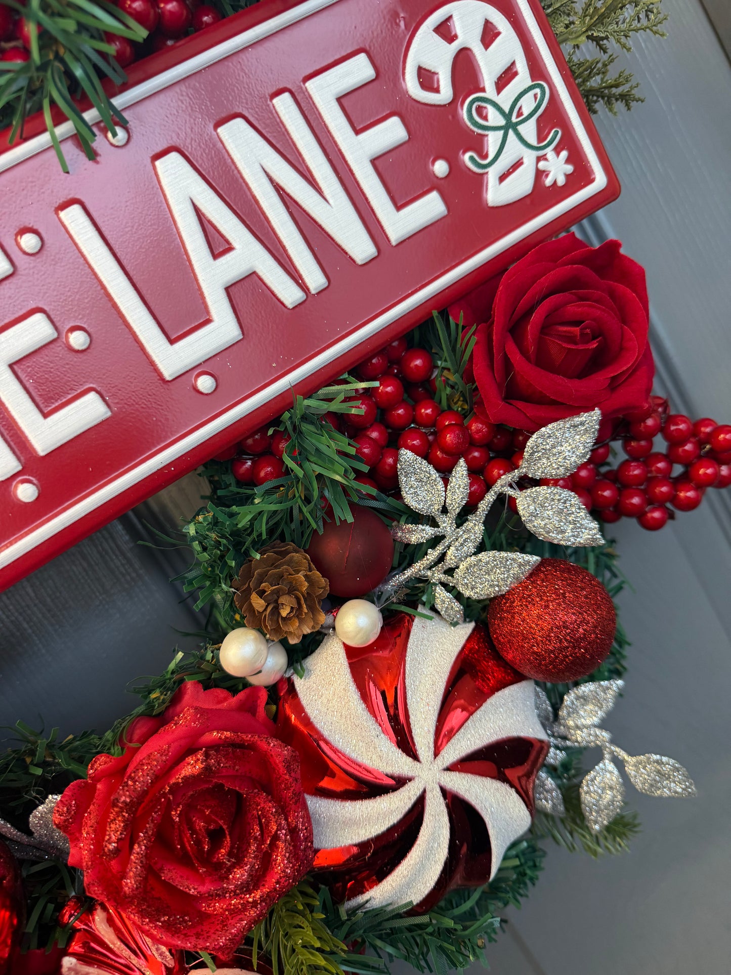 Candy Cane Lane Christmas Artificial Wreath – Gingerbread & Candy Theme Door Decor – Red & White Holiday Wreath with Baubles, Berries, Roses & Sign